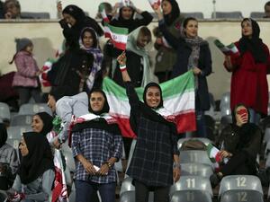 Iranian women cheer during the friendly football match between Iran and Bolivia at the Azadi Stadium in Tehran on October 16, 2018.
STR / AFP