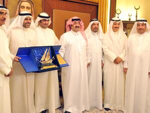 Minister of Information and Minister of State for Youth Affairs Mohammad Al-Jabri at a ceremony, honoring Minister of Commerce and Industry Khaled Al-Roudhan (Photo: KUNA)