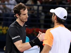 World number one Andy Murray (L) of Great Britain embraces Spain's Fernando Verdasco following their ATP final tennis match which Murray won, concluding the Dubai Duty Free Championships on March 4, 2017.
KARIM SAHIB / AFP