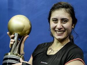 Nour El Sherbini of Egypt poses with her trophy after winning against Laura Massaro of England after their final match of the PSA Women's World Championships squash tournament in Bukit Jalil, oustide Kuala Lumpur on April 30, 2016.
MOHD RASFAN / AFP