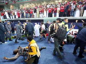Wounded fans await treatment after a glass barrier broke at the end of the Gulf Cup of Nations 2017 final football match between Oman and the UAE at the Sheikh Jaber al-Ahmad Stadium in Kuwait City on January 5, 2018.
Yasser Al-Zayyat / AFP