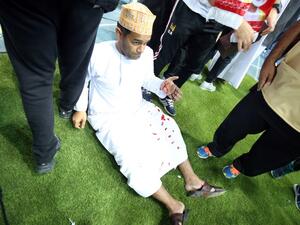 A wounded fan awaits treatment after a glass barrier broke at the end of the Gulf Cup of Nations 2017 final football match between Oman and the UAE at the Sheikh Jaber al-Ahmad Stadium in Kuwait City on January 5, 2018.
Yasser Al-Zayyat / AFP