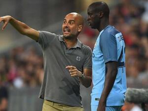 يايا توريه ومدربه جوسيب غوارديولا