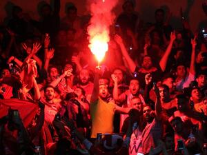 Persepolis fans cheer during the Asian Champions League football match between UAE's Al-Wahda and Iran's Persepolis at the Azadi Stadium in Tehran on May 8, 2017.
ATTA KENARE / AFP