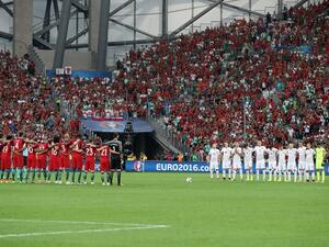 Poland's and Portugal's players line up during a moment of applause in memory of victims of the Istanbul airport attack prior to the Euro 2016 quarter-final football match between Poland and Portugal at the Stade Velodrome in Marseille on June 30, 2016.
Valery HACHE / AFP