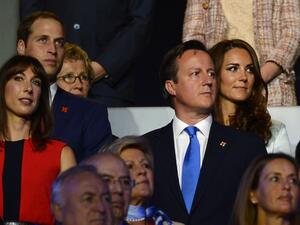 Britain's Prince William and his wife Catherine (back) stand with Britain's Prime Minister David Cameron and his wife Samantha (front) during the opening ceremony of the London 2012 Olympic Games on July 27, 2012 at the Olympic stadium in London. AFP PHOTO / LEON NEAL
LEON NEAL / AFP