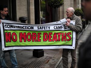 Protesters demonstrate against the perceived exploitation of workers in Qatar, the location of the 2022 World Cup, before a UEFA Congress in central London on May 24, 2013. AFP PHOTO/CARL COURT
CARL COURT / AFP
