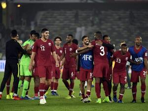 لاعبو قطر يحتفلون بالتأهل