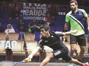India’s Saurav Ghosal (left) in action against Kuwait’s Ammer al-Tamimi during the qualifying round for the Qatar Classic squash yesterday. (Photo: Jayan Orma)
