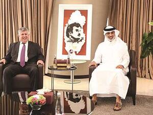 Qatar Football Association president Sheikh Hamad bin Khalifa bin Ahmed al-Thani (right) with his Iraqi counterpart Abdulkhaleq Masoud in Doha yesterday. (Photo: Qatar Times)