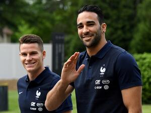 France's forward Kevin Gameiro (L) and defender Adil Rami walk at the French national football team training base in Clairefontaine on May 24, 2016, as part of the team's preparation for the upcoming Euro 2016 European football championships.
FRANCK FIFE / AFP