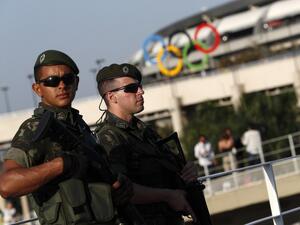 Brazilian security forces stand guard outside the Maracana stadium in Rio de Janeiro on August 5, 2016. A vast security blanket of 85,000 military personnel and police -- twice the number on duty at the 2012 London Games -- are draped over the city to ward off the threat of street crime and terror attacks.
Adrian DENNIS / AFP