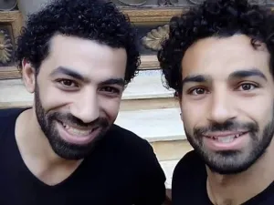 The duo had identical smiles, identical hair, identical beards, and was wearing identical shirts to make things more confusing.