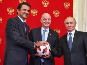 (From L) Emir of Qatar Sheikh Tamim bin Hamad Al-Thani, FIFA President Gianni Infantino and Russian President Vladimir Putin pose for a photography during a symbolic transfer of the authority to Qatar to host the World Cup 2022 at the Kremlin in Moscow on July 15, 2018.
Yuri KADOBNOV / POOL / AFP