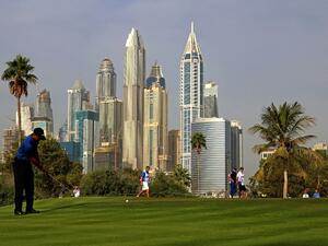 Tiger Woods of the United States follows his ball after playing a shot during the Dubai Desert Classic golf tournament at the Emirates Golf Club in Dubai on February 2, 2017.
NEZAR BALOUT / AFP