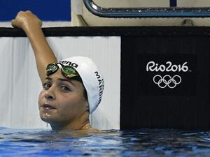 Refugee Olympic Team's Yusra Mardini takes part in the Women's 100m Butterfly heat during the swimming event at the Rio 2016 Olympic Games at the Olympic Aquatics Stadium in Rio de Janeiro on August 6, 2016.
Martin BUREAU / AFP