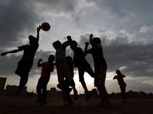 Yemeni children play football in a field in the capital Sanaa on June 10, 2014. AFP PHOTO/MOHAMMED HUWAIS
MOHAMMED HUWAIS / AFP