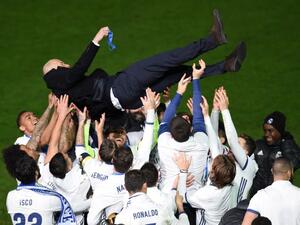 Real Madrid head coach Zinedine Zidane is thrown into the air by Real Madrid players after winning the Club World Cup football final match against Kashima Antlers of Japan at Yokohama International stadium in Yokohama on December 18, 2016.
Toru YAMANAKA / AFP