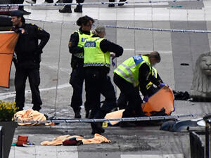 Emergency services work at the scene where a truck crashed into the Ahlens department store at Drottninggatan in central Stockholm, April 7, 2017. (AFP/Jonathan Nackstrand)