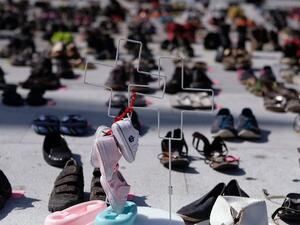 Shoes set aside to represent the thousands who likely died during Hurricane Maria (RICARDO ARDUENGO/AFP)
