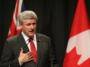 Canada's PM Stephen Harper made an unexpected visit to Iraq, where he met with his Iraqi counterpart Haider al-Abadi Saturday.  (AFP/David Rowland)