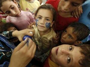 Children in the northern Gaza Strip town of Jabalia attend a UN-sponsored mental health program in August 2014 to cope with trauma sparked by war.  (AFP/Mohammed Abed)
