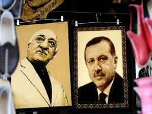 A market in Gaziantep, Turkey displays embroidered images of US-based Turkish preacher Fethullah Gulen (left) and President Recep Tayyip Erdogan (right).  (AFP/Ozan Kose)