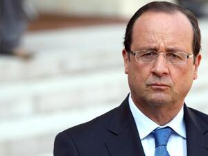 FRANCE, Paris : France's President Francois Hollande speaks during a press conference after a meeting with the President of the National Coalition for Syrian Revolutionary and Opposition Forces (SNC) at the Elysee presidential palace on August 29, 2013 in Paris. AFP PHOTO / KENZO TRIBOUILLARD