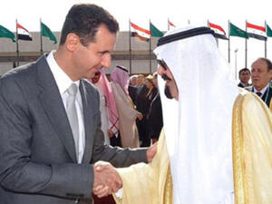 العاهل السعودي (يمين) والرئيس السوري خلال لقاء سابق