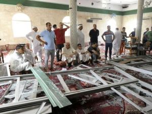 Locals examine the damage to Imam Ali mosque in Qatif, Saudi Arabia following last Friday's suicide bomb attack that left 21 dead.  (AFP/File)