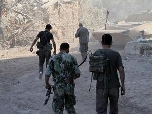 SYRIA, JOBAR : Syrian army soldiers are seen deployed in the Jobar neighbourhood of Damascus on August 24, 2013. AFP PHOTO / STR