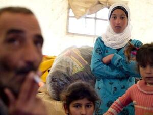 عائلة سورية مشردة