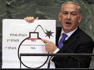 Benjamin Netanyahu shows an illustration as he describes his concerns over Iran's nuclear ambitions during his address to the 67th session of the United Nations General Assembly last September. [AP]