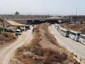 حافلات لنقل المسلحين وعائلاتهم من أحياء دمشق/ أرشيفية