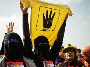 A female supporter of the Muslim Brotherhood and of ousted president Mohamed Morsi during a rally outside the Police Academy where his trial is taking place on November 4, 2013, in Cairo. [GIANLUIGI GUERCIA/AFP/Getty Images]