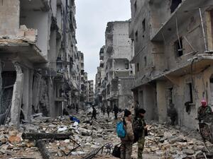 Pro-government forces shelled the city’s al-Waer neighbourhood with tank and artillery fire in conjunction with the airstrikes. (AFP/File) 
