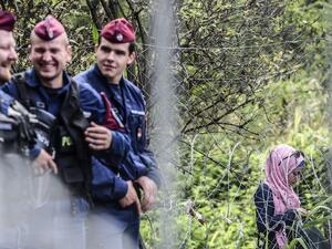 A Syrian refugee at the Hungarian border (Armend Nimani/AFP)