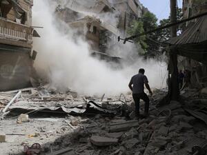 A man walk amidst the rubble following a reported air strike by Syrian government forces in the rebel-held neighborhood of Qatirji on June 5, 2016. (AFP/Baraa al-Halabi)