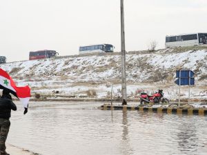 Syrian rebel fighters, are evacuated from Aleppo towards rebel-held territory in the west of Aleppo's province on December 22, 2016. (AFP/Youssef Karwashan) 