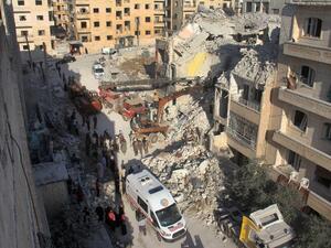 Syrian Civil Defence members search on May 31, 2016 for survivors amid the rubble following reported Russian air strikes the previous night on the Syrian northwestern city of Idlib. (AFP/Omar Haj Kadour)