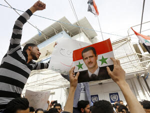 Syrians protest outside the UN's office in Damascus in support of the President, Bashar al-Assad, April 11 2017. (AFP/Louai Beshara)