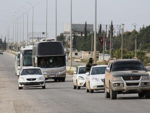 Syrian prisoners arrive in rebel-held Rashidin after their release from government jails, April 21 2017. (AFP/Omar Haj Kadour)