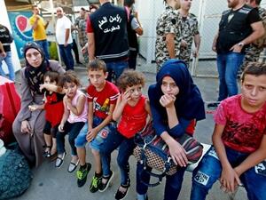 Syrian refugees gather as they prepare to leave the Lebanese capital Beirut, before their journey to return home to Syria on September 4, 2018. (AFP /ANWAR AMRO)