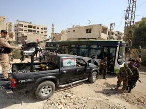 The 15th convoy carrying civilians and opposition fighters has arrived in Aleppo’s Al-Bab district. (AFP/ File Photo)