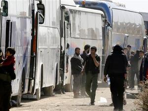 The convoy of 15 buses carried 700 evacuees, including 60 children and 30 women. (AFP/ File)