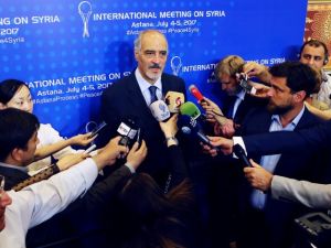 Syrian chief negotiator and Ambassador of the Permanent Representative Mission of Syria to the United Nations Bashar al-Jaafari (C) speaks to the press during a fifth round of Syria peace talks on July 5, 2017, in Astana. (Stanislav Filippov/AFP)