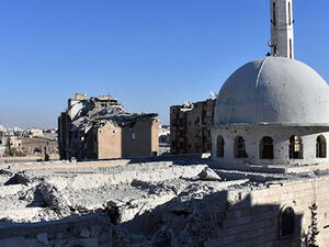 A damaged mosque stands in the Masaken Hanano district in eastern Aleppo, a day after Syrian pro-government forces seized it from rebel fighters (AFP/George Ourfalian)