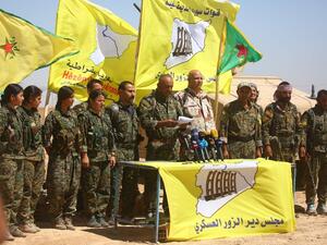 A local military chief announces the launch of a new SDF offensive to oust the Islamic State (IS) group from swathes of Syria's eastern Deir Ezzor province on September 9, 2017 (Delil Souleiman/AFP)