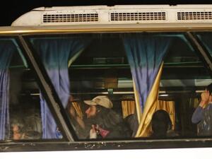 Members of ISIS and their families are transported from the Lebanese border to eastern Syria (Louai Beshara/AFP)