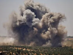 Smoke rises above opposition held areas of Daraa during airstrikes by Syrian regime forces on June 26, 2018. (Mohamad ABAZEED/AFP)